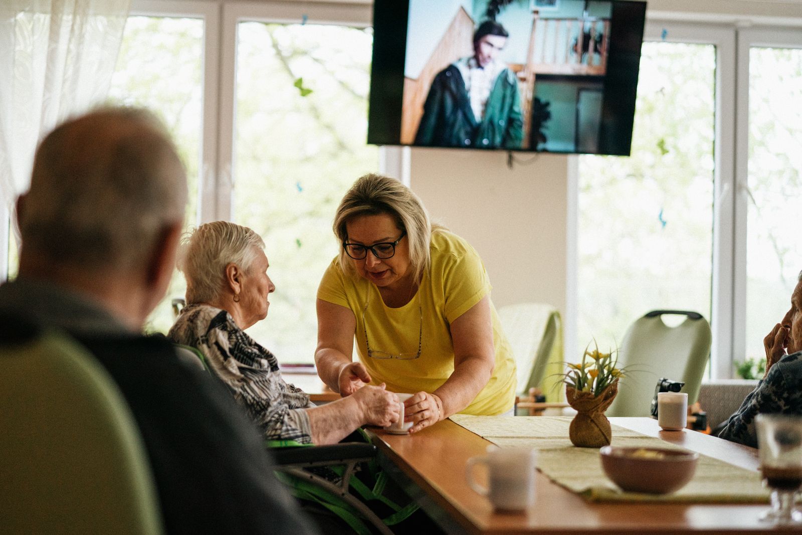Caregiver assisting a senior adult at home
