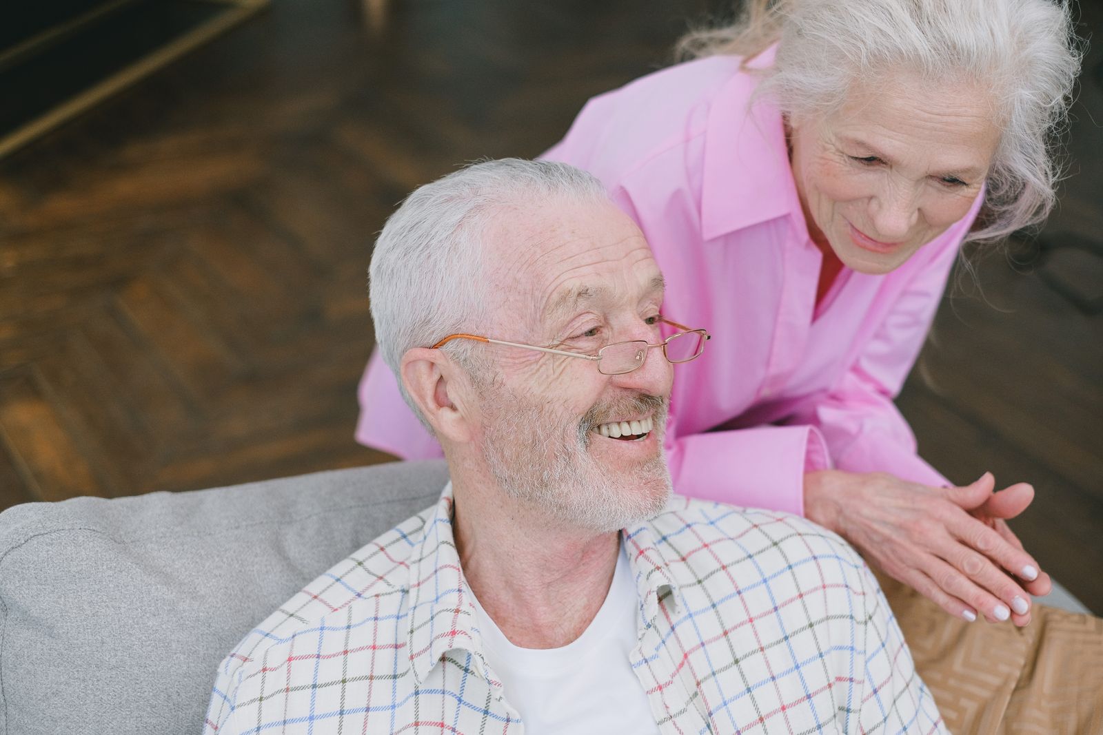 Elderly couple talking at home