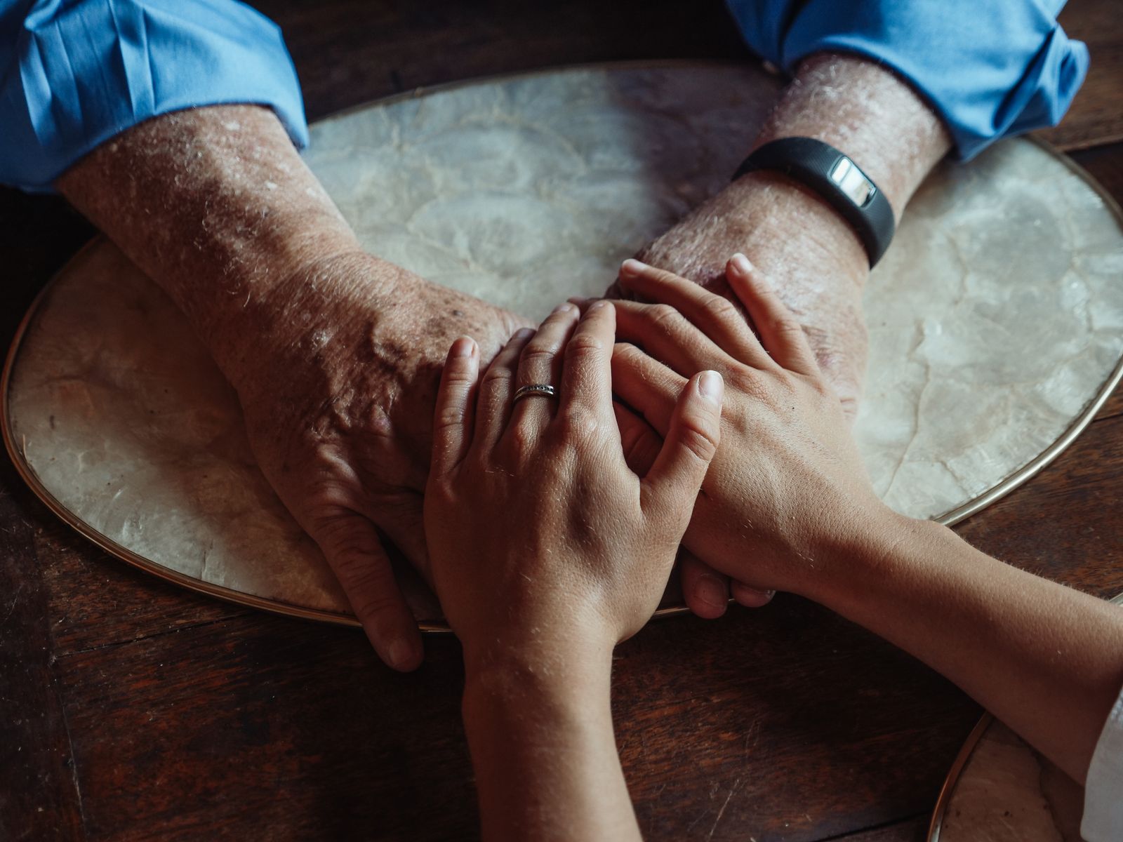 Close up of elderly and young hands joined